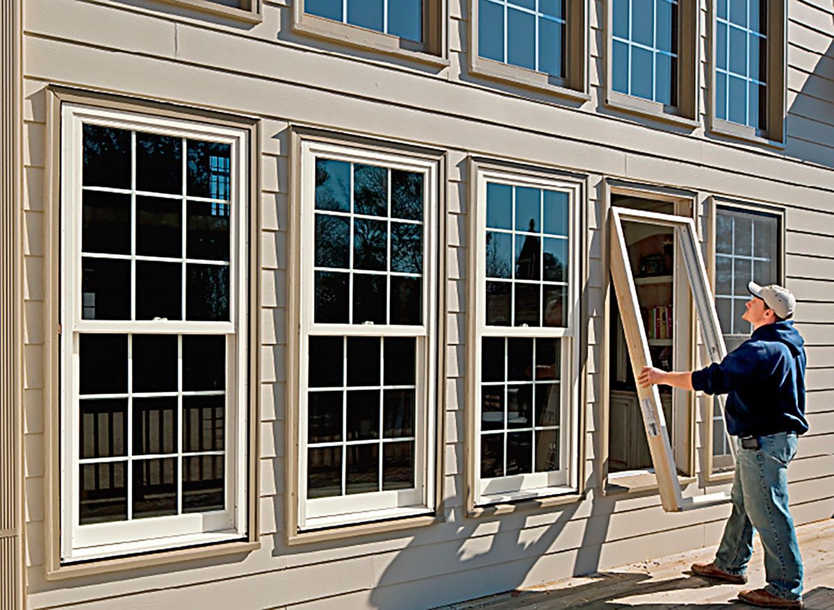 Fiberglass windows being installed in a home.