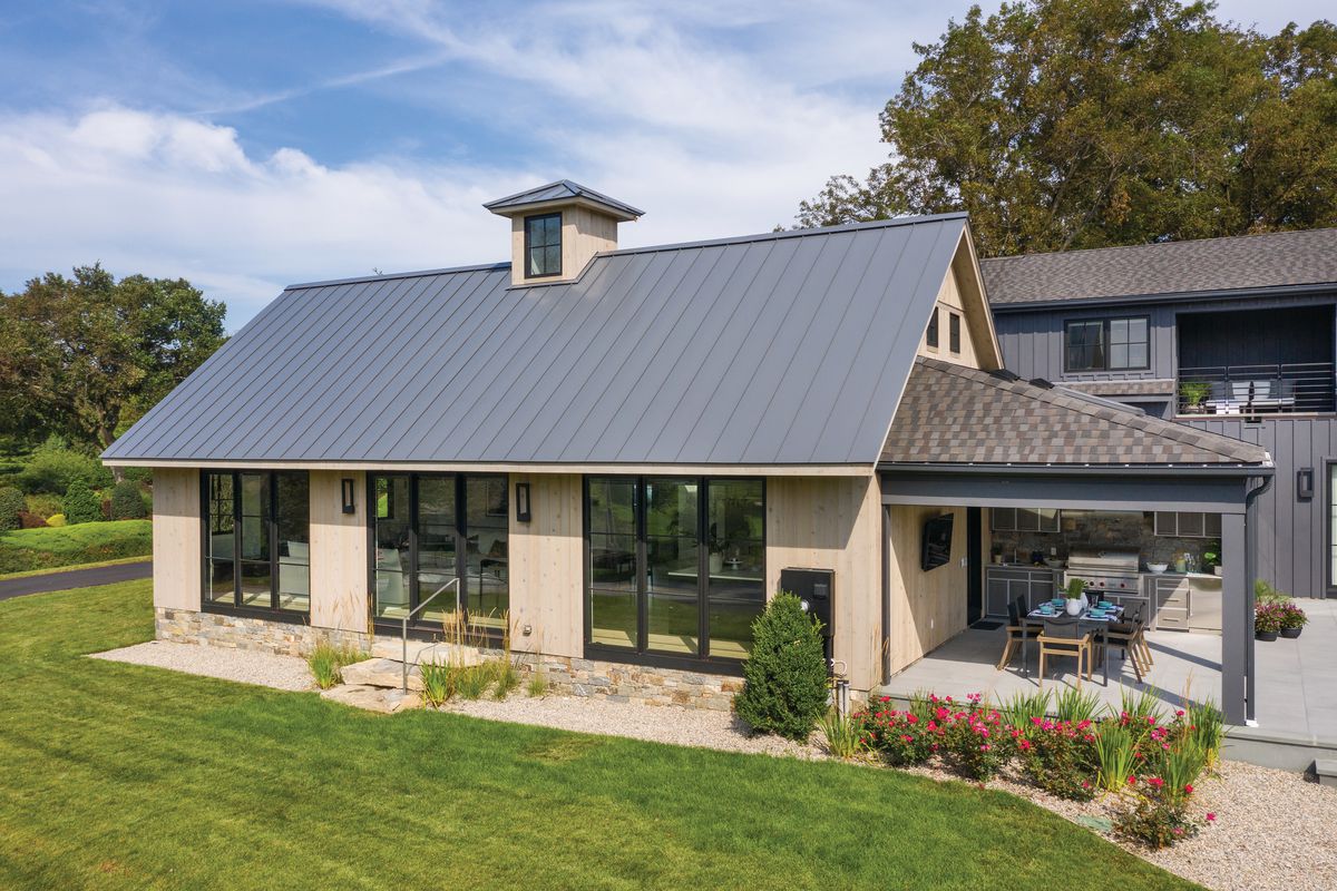 Metal roof shows example of sustainable home building trend.