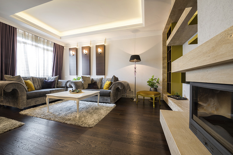 Dark hardwood floors make a living room look classic and elegant.