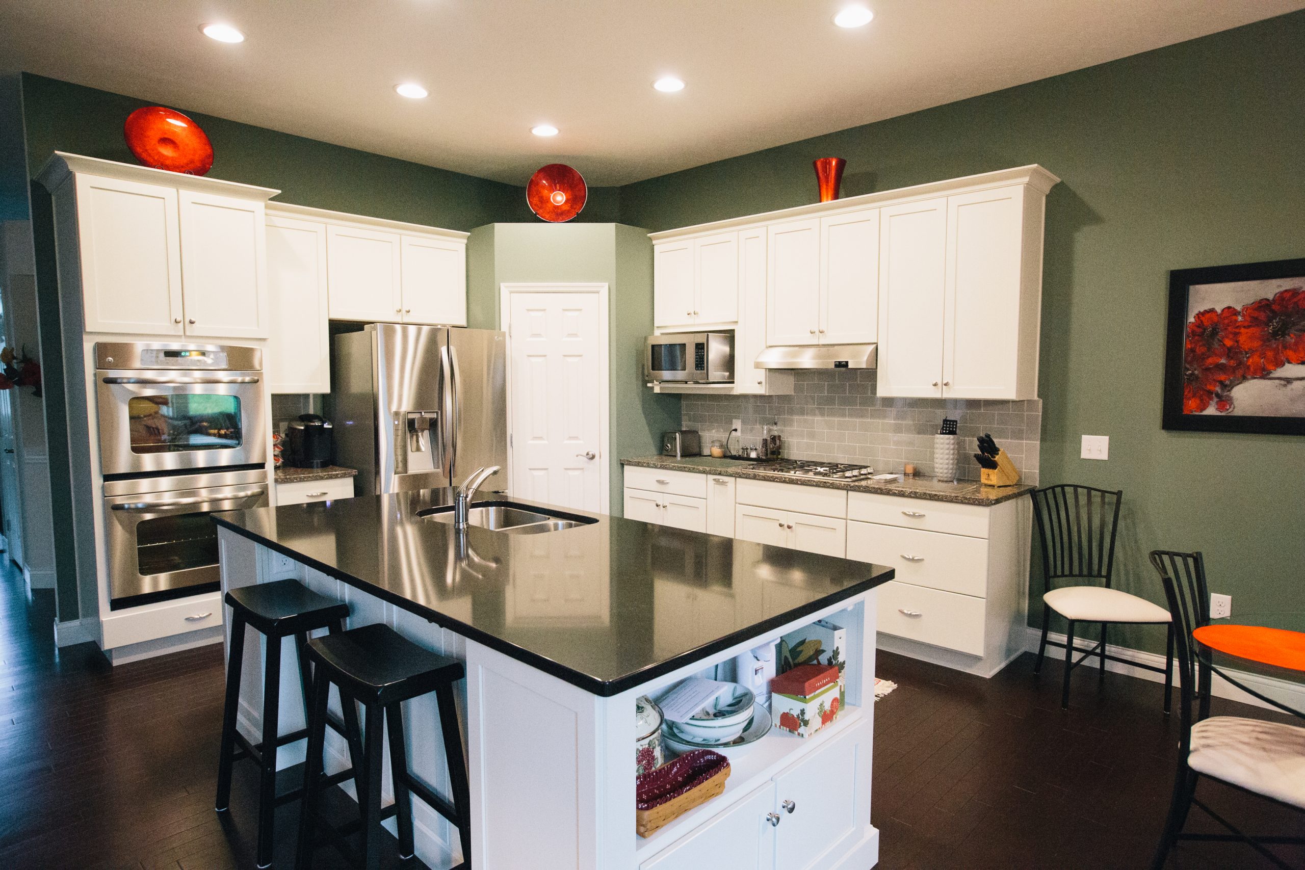 Green paint colors like sage give kitchens a natural feel.