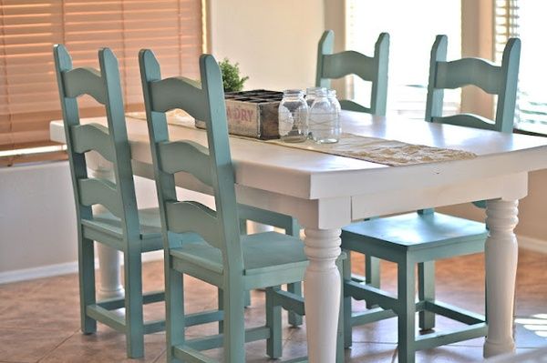 Kitchen chairs painted a light blue color.