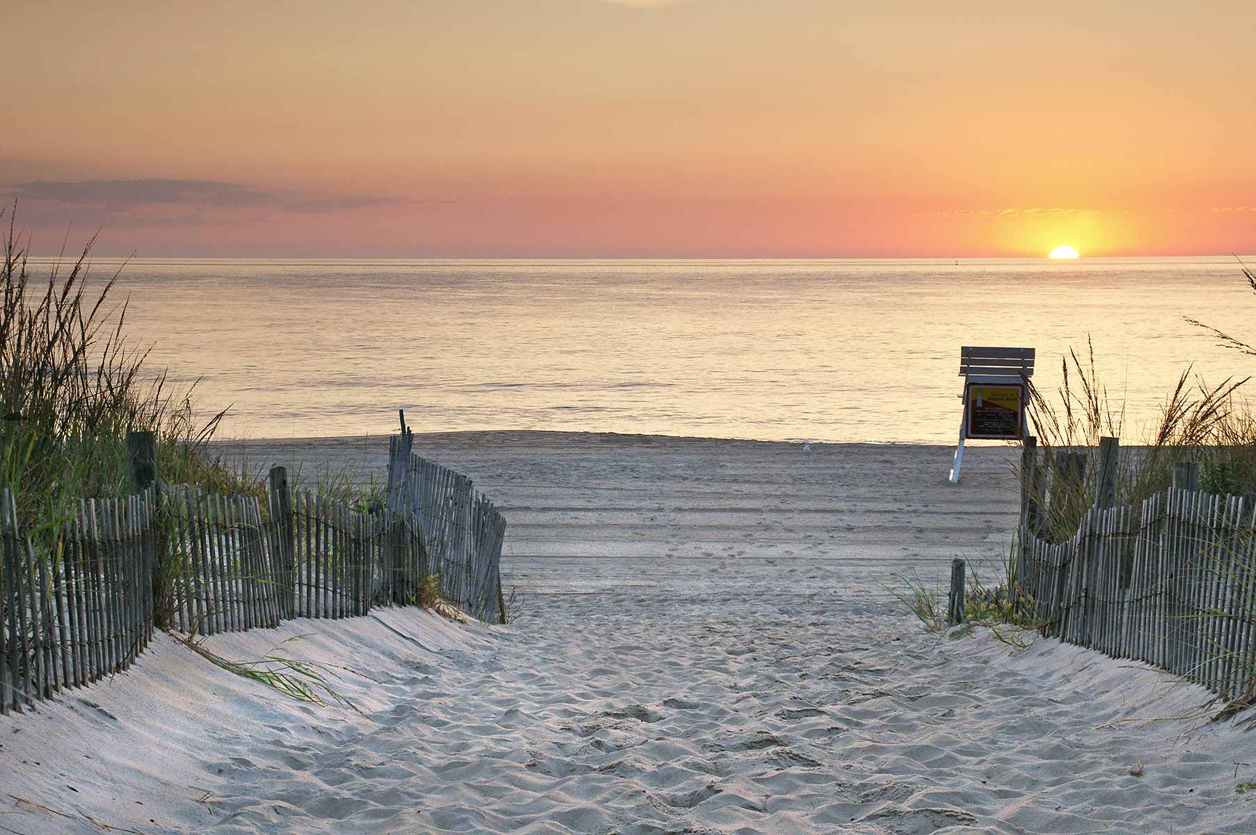 Beachfront sunset view in Dewey Beach, Delaware.