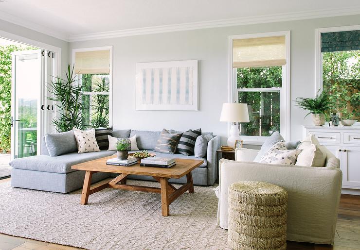 Alt-Text: Greige living room walls accented by both gray and beige furniture.