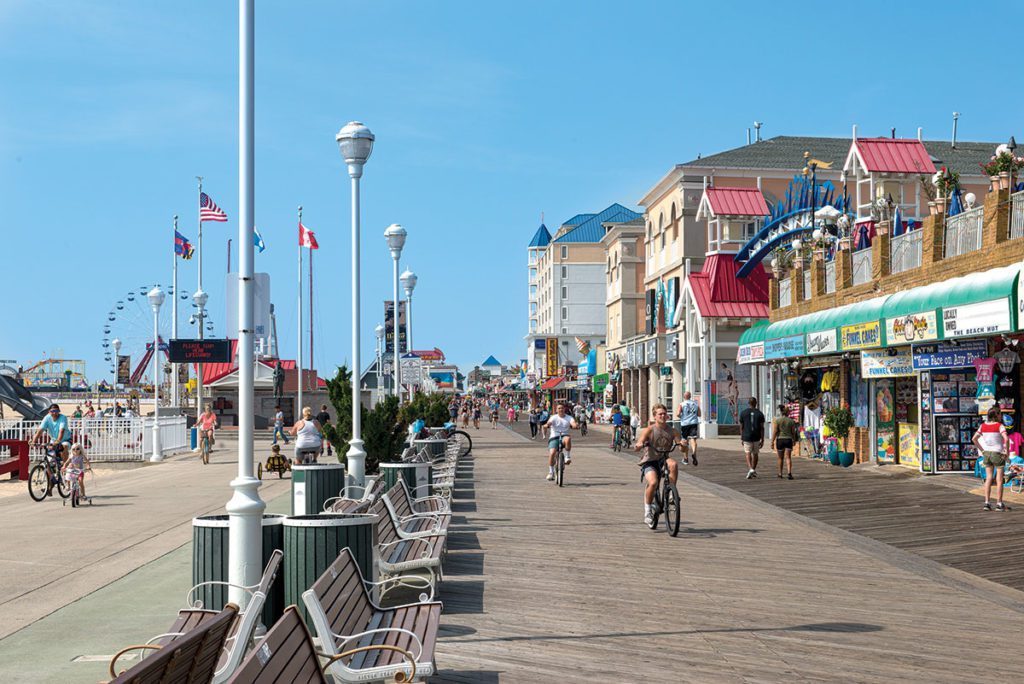 Cyclists and walkers on the boardwalk at Ocean City, MD.