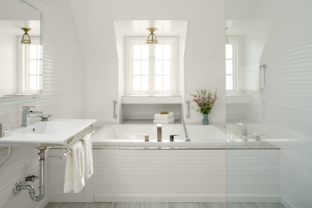 Bathroom with white walls and fixtures