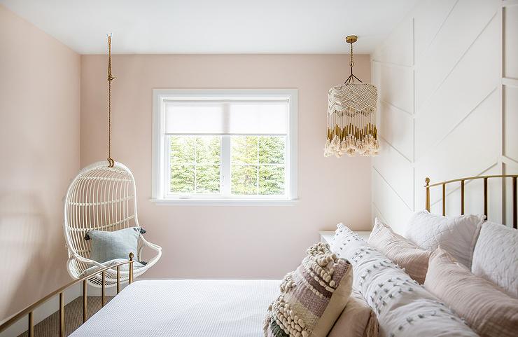 Bright bedroom with natural light and blush pink walls