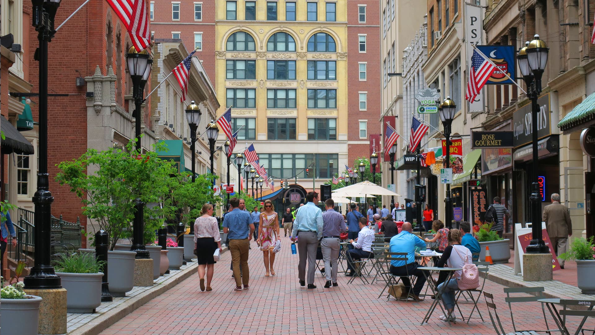 People walking down a pedestrian street in downtown Hartford, CT.
