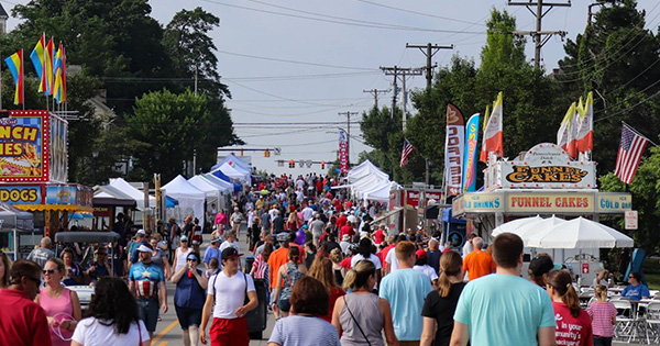 People and booths fill the street at the Americana festival in Centerville, OH. 