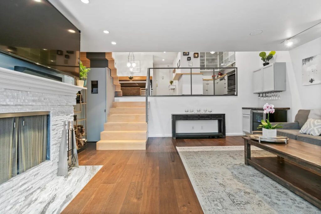 Split level living area with steps leading to additional common areas